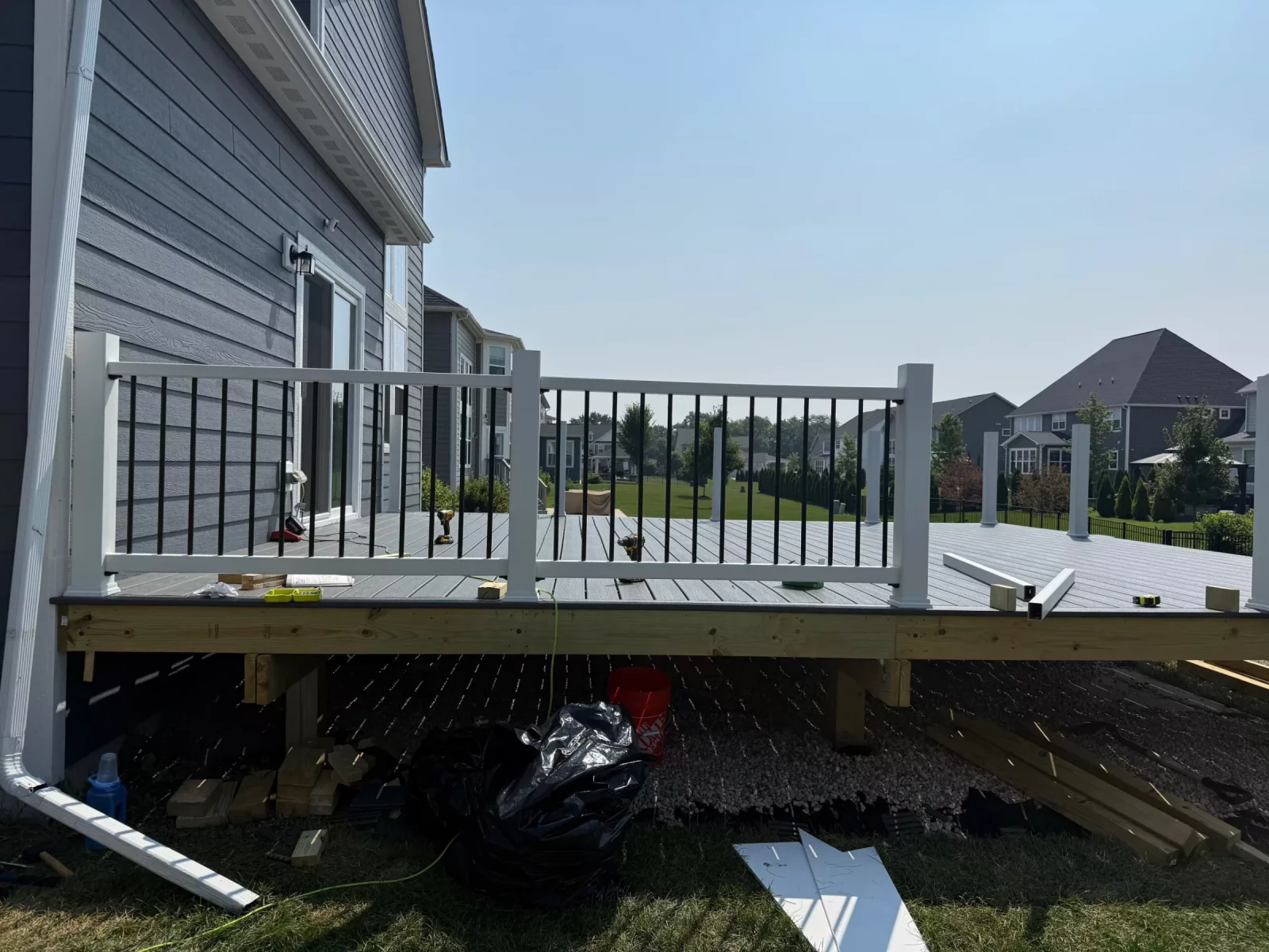 View from a composite deck with gray decking and modern railing overlooking the neighborhood in Naperville, IL