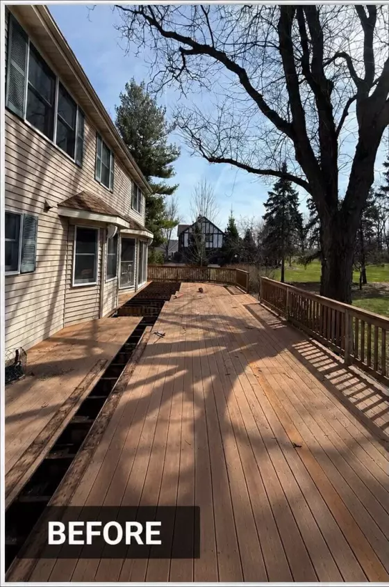 Weathered wood deck with worn, stained boards before resurfacing at a West Chicago, IL home