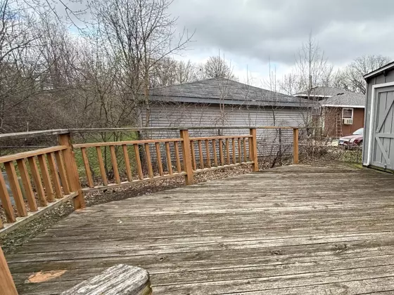 Weathered wood deck and railing before composite upgrade in Aurora, IL